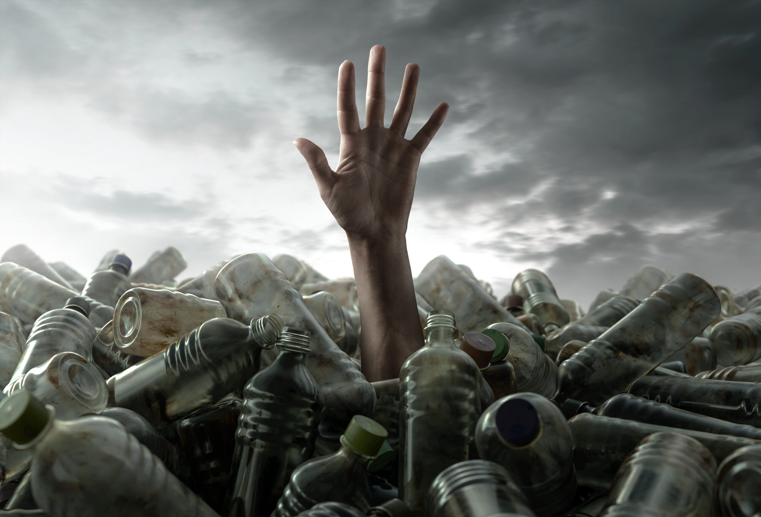 hand reaching out for plastic waste
